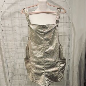 UNIF Shimmering Silver Strap Ropper Size Medium Side pockets. Unisex.